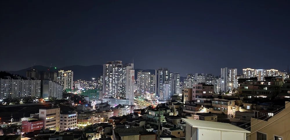 Night view of Busan city from an elevated neighborhood spot near Cafe Magnate