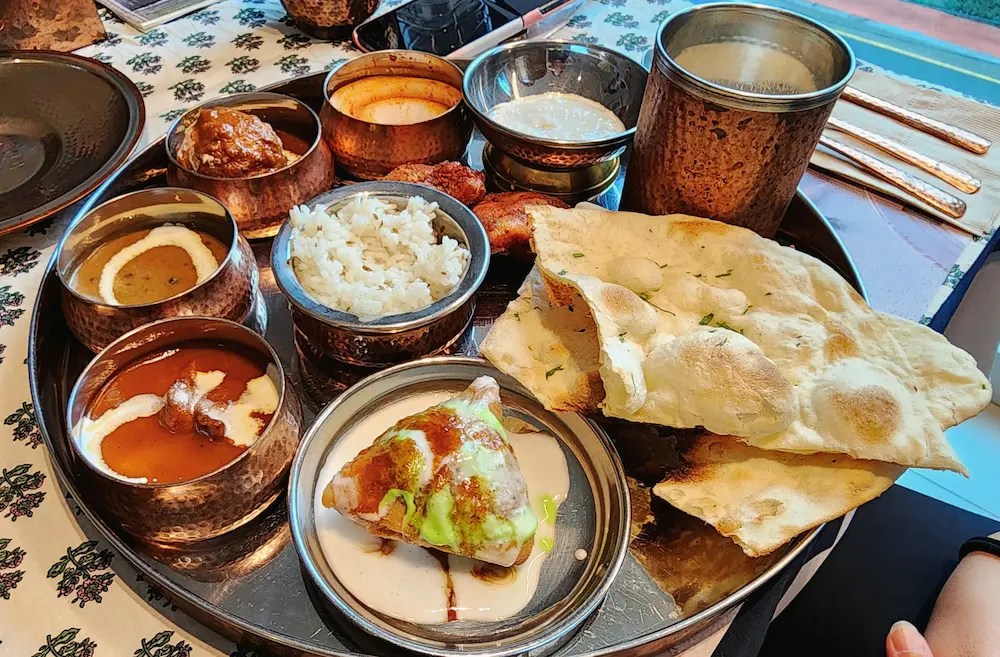 South India Goan Thali Set with shrimp, rice, naan, and various curries at Bhavan Indian Restaurant in Busan