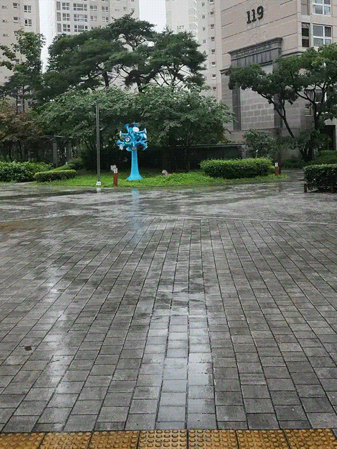 Rain falling on the street in Busan — a quiet, grey day.
