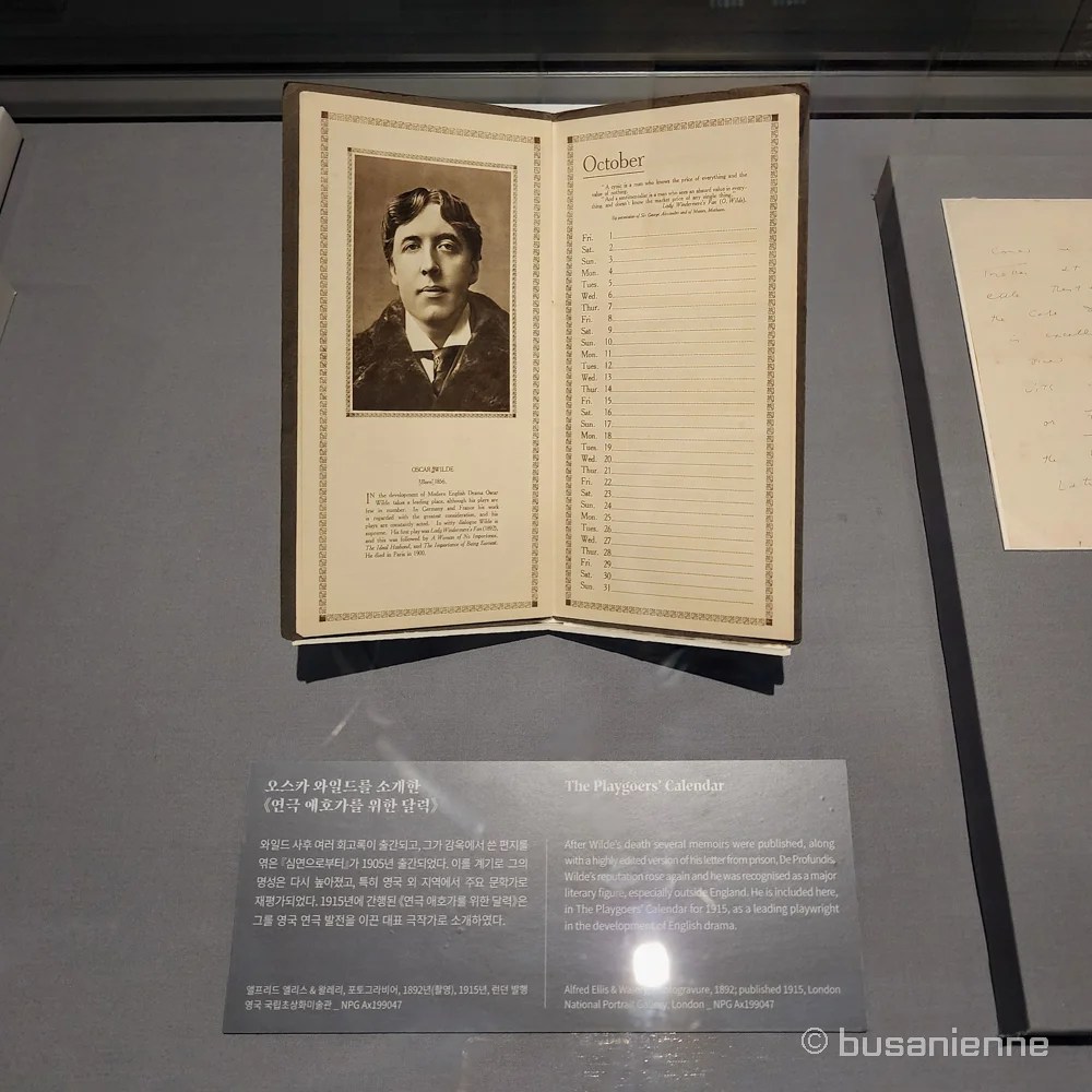 Open display of The Playgoers’ Calendar featuring Oscar Wilde, with a photograph taken in 1892 and published in 1915, shown at the Writers Revealed exhibition in Busan